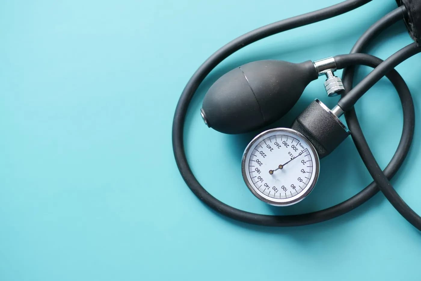 Blood pressure monitor on a table, representing the topic of mudra for high BP