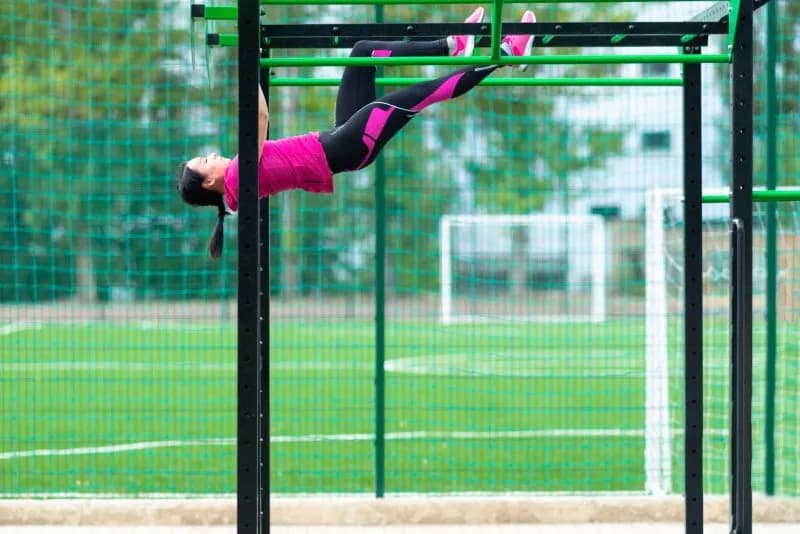 active-woman-does-gymnastics-on-outdoor-fitness-eq-2026-01-11-08-49-36-utc-1.jpg