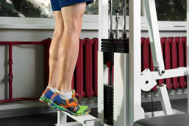 adult-exercising-using-calf-raise-machine-in-gym-2026-03-16-03-17-38-utc-1.jpg