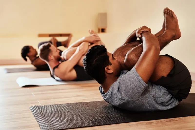 adults-in-yoga-class-holding-knees-2026-01-09-10-05-47-utc.jpg