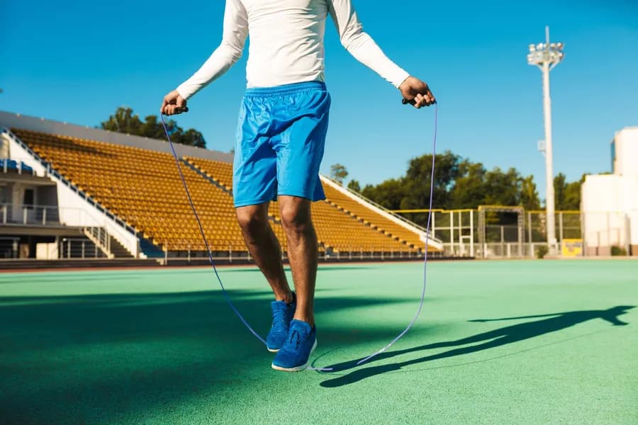 Close-up of a sportsman jumping rope during a skipping exercise session