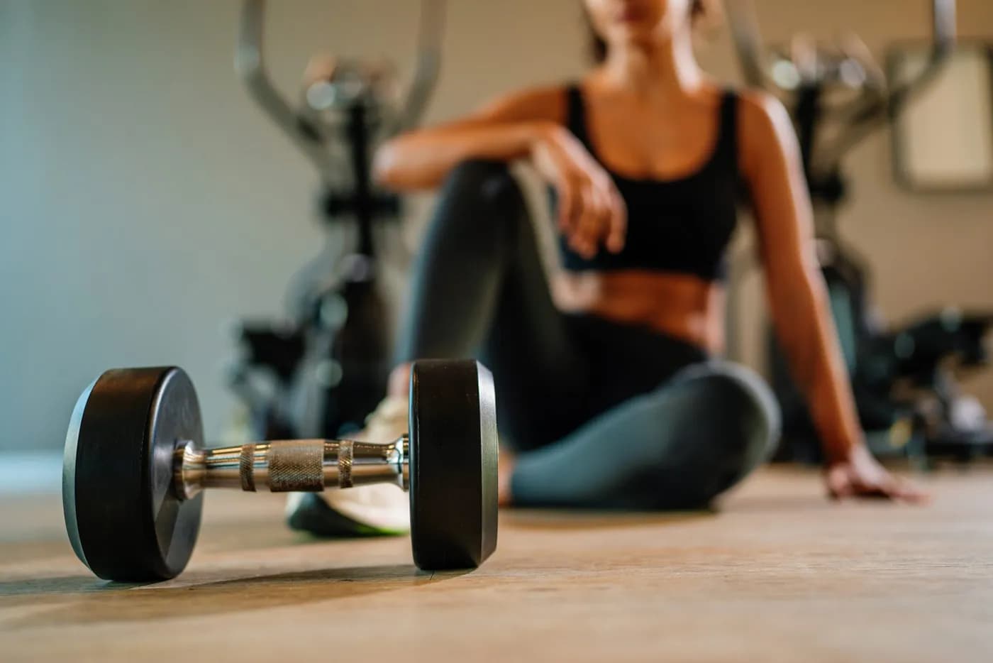 Sporty woman running on a treadmill during a strength and fitness workout