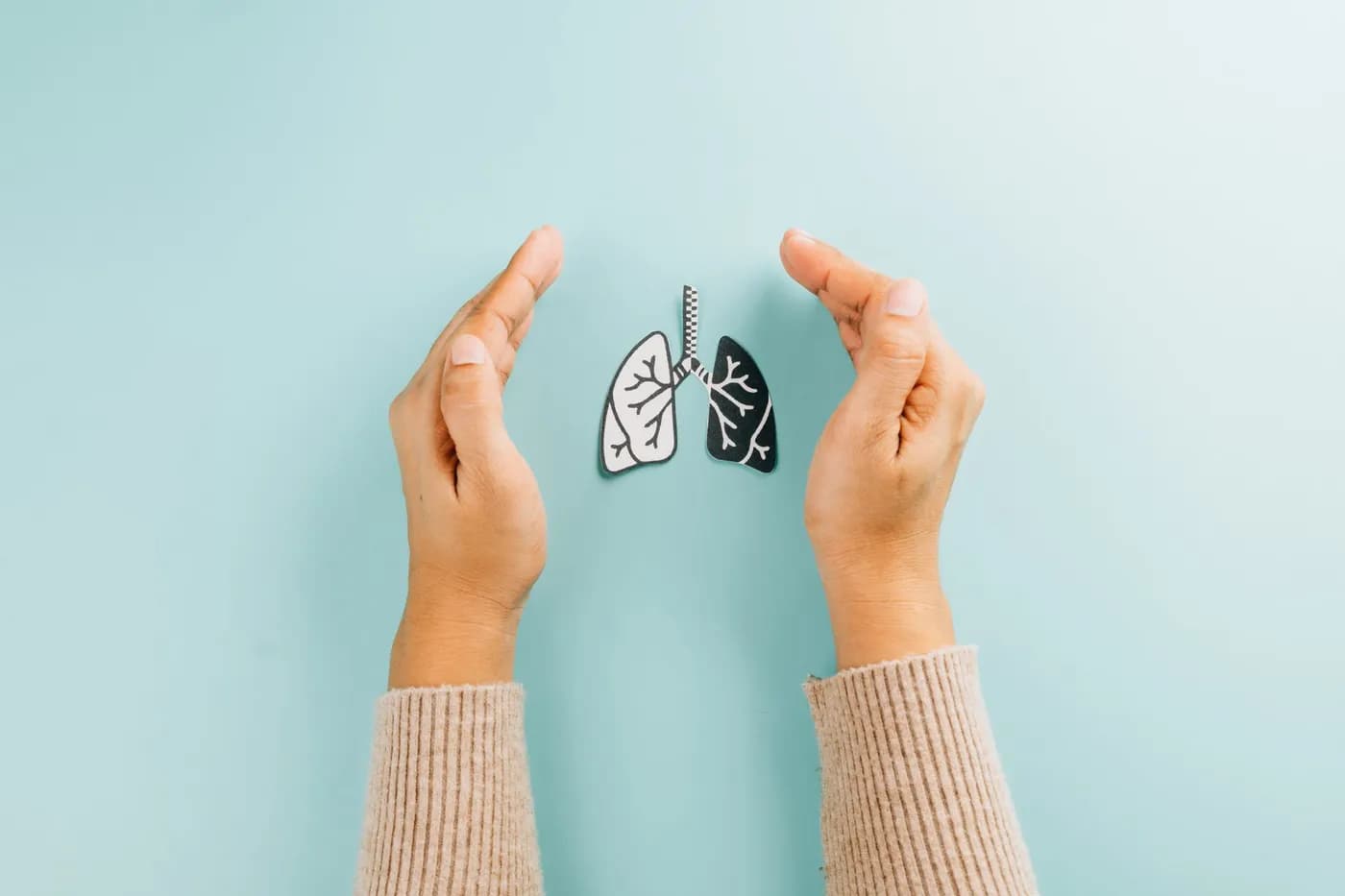 Person practicing deep breathing to strengthen lung health