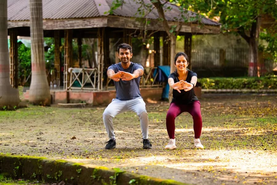A couple doing squats