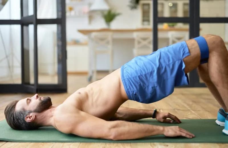 man-exercising-with-resistance-band-in-home-2026-01-09-07-03-41-utc.jpg