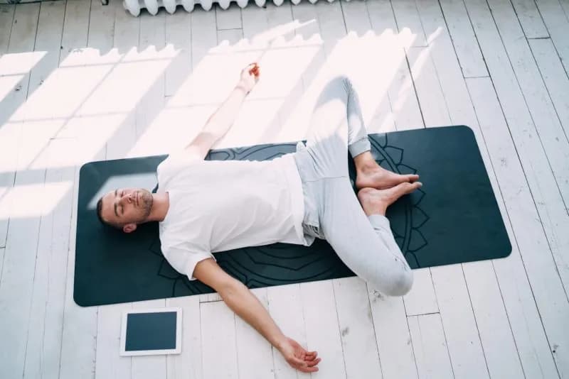 relaxed man practicing reclining bound angle asana 2025 12 31 02 21 53 utc