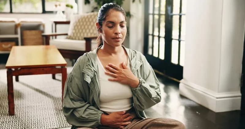 serene woman practicing mindful breathing exercise