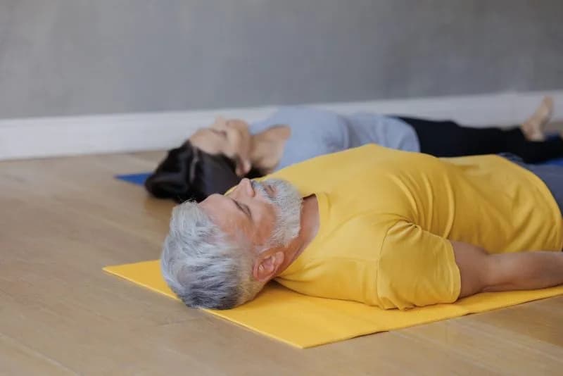 shavasana man and woman do yoga in sports studio 2026 01 08 05 41 05 utc