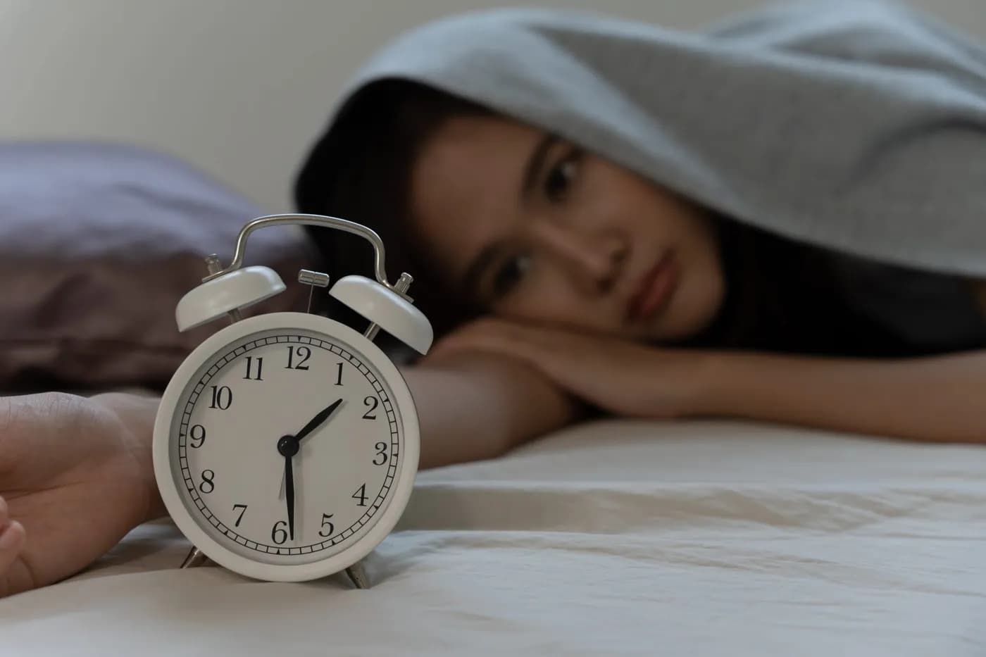 Clock at night showing trouble sleeping at night