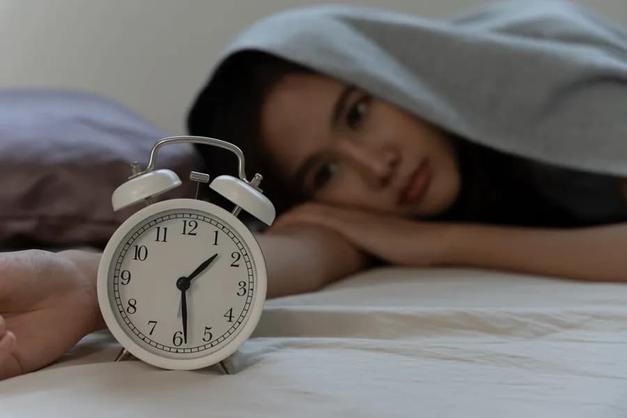 Clock at night showing trouble sleeping at night