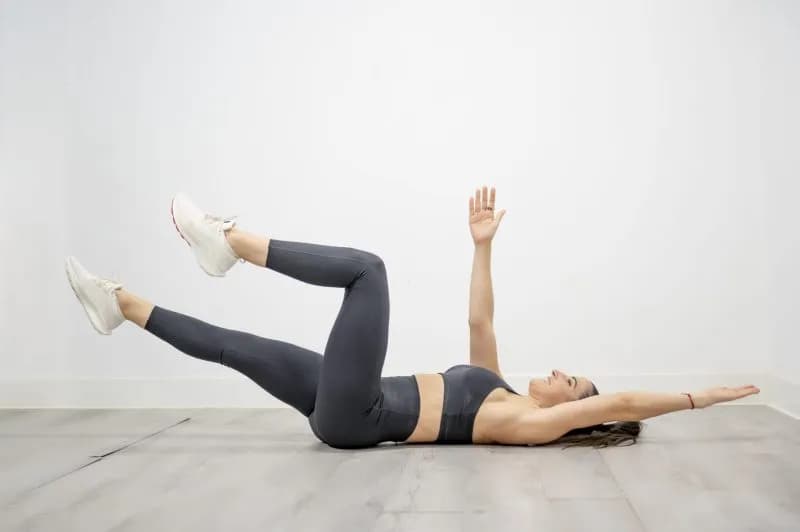 woman lying on floor stretching in athletic clothi 2026 01 09 11 58 01 utc 3