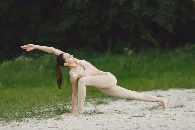 woman practicing advanced yoga in a beach 2026 03 17 14 37 44 utc 1
