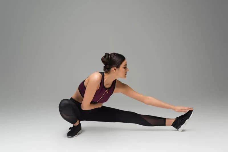 woman-stretching-in-black-leggings-and-sports-bra-2026-03-11-04-22-46-utc.jpg